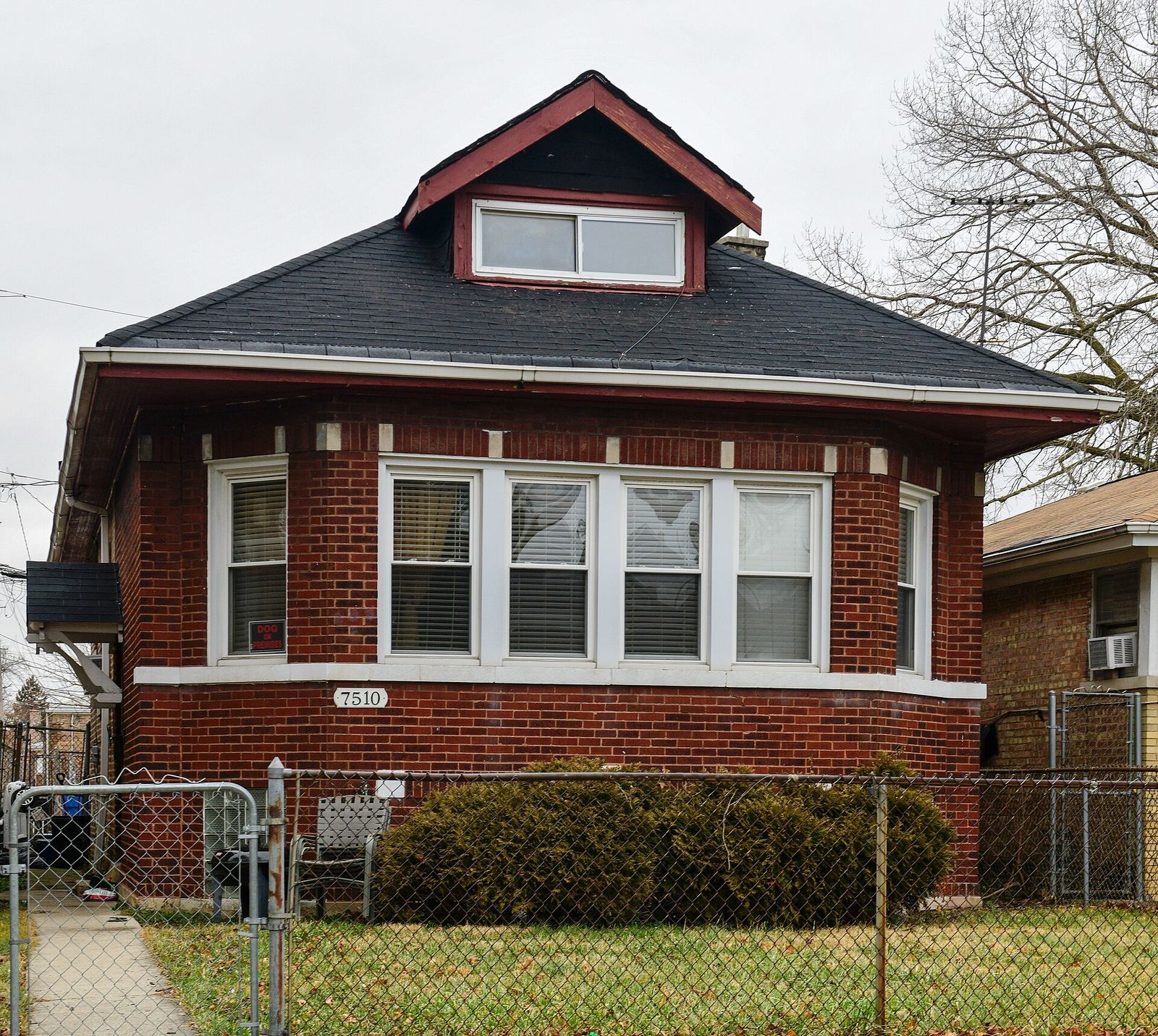 Brick Chicago bungalow with a hip roof and a front dormer
